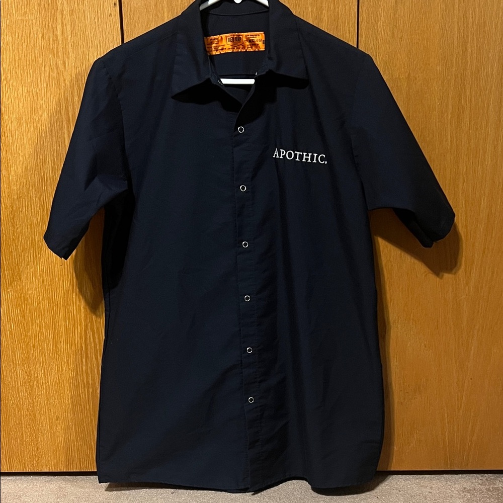 Red Kap navy short sleeve work shirt. APOTHIC brand embroidered on front left